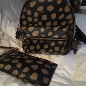 Coach Mini Charlie backpack and wristlet .